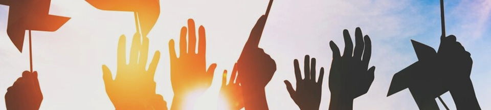 Hands in the air in a sunny weather